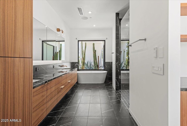 5301 N 43rd St, Phoenix, AZ 85018 - full bath featuring a freestanding bath, double vanity, and recessed lighting