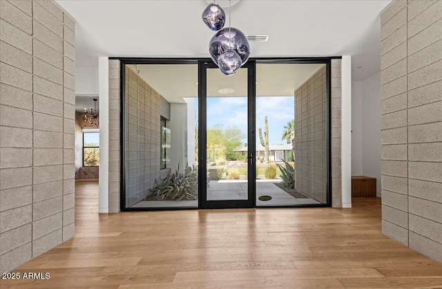 5301 N 43rd St, Phoenix, AZ 85018 - unfurnished dining area featuring a wall of windows and wood finished floors