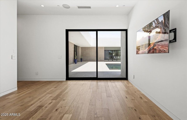5301 N 43rd St, Phoenix, AZ 85018 - unfurnished room with hardwood / wood-style flooring and recessed lighting