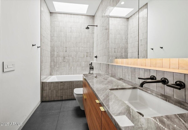 5301 N 43rd St, Phoenix, AZ 85018 - full bath with a skylight, vanity, tiled shower / bath, and tile patterned flooring