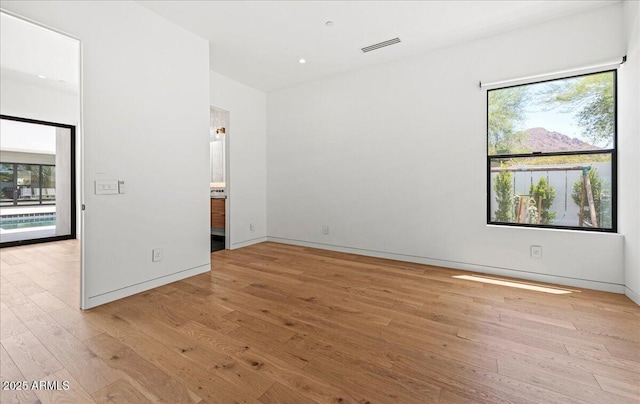5301 N 43rd St, Phoenix, AZ 85018 - unfurnished bedroom featuring light wood finished floors and multiple windows
