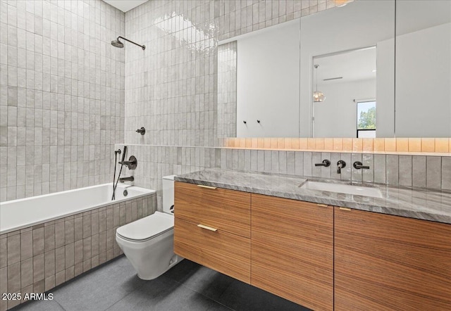 5301 N 43rd St, Phoenix, AZ 85018 - full bath featuring tile walls, tiled shower / bath combo, vanity, and tile patterned flooring