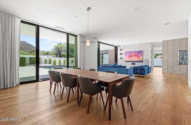 5301 N 43rd St, Phoenix, AZ 85018 - dining room with light wood-style flooring and expansive windows