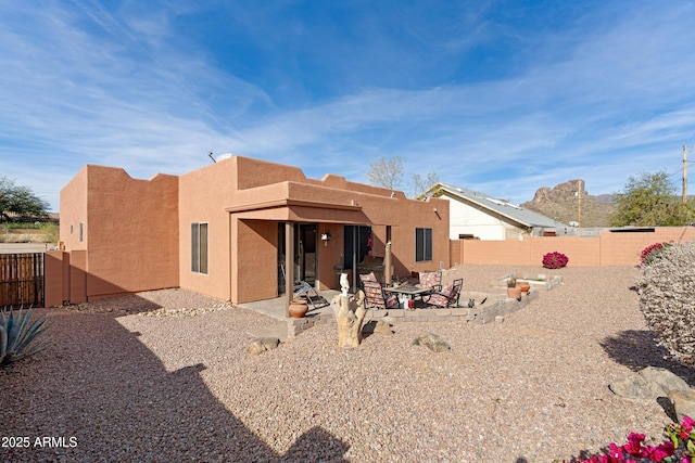 rear view of property with a patio area