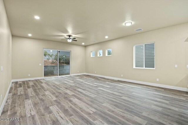 1910 E Rainbow Trl, Payson, AZ 85541 - spare room featuring ceiling fan, recessed lighting, wood finished floors, and baseboards