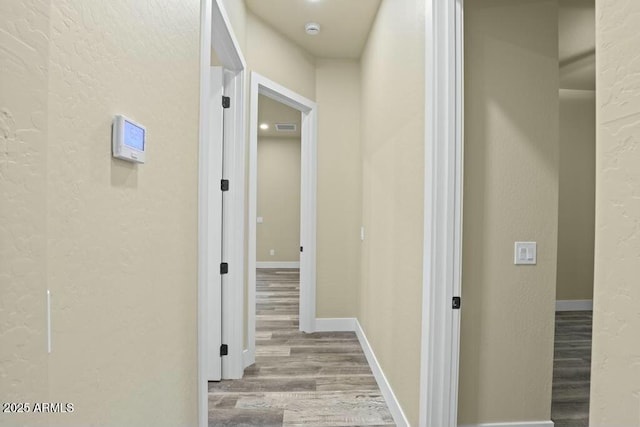 1910 E Rainbow Trl, Payson, AZ 85541 - corridor with baseboards, wood finished floors, and a textured wall