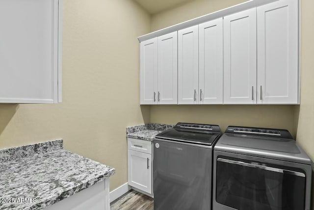 1910 E Rainbow Trl, Payson, AZ 85541 - clothes washing area featuring wood finished floors, washing machine and clothes dryer, cabinet space, and baseboards