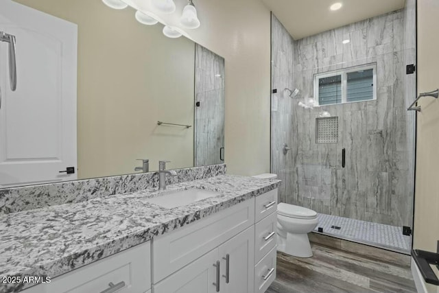 1910 E Rainbow Trl, Payson, AZ 85541 - bathroom with toilet, a stall shower, wood finished floors, and vanity