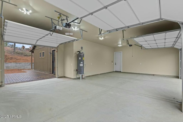 garage featuring a garage door opener and electric water heater