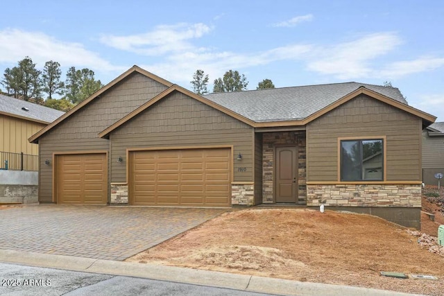 1910 E Rainbow Trl, Payson, AZ 85541 - view of front of home featuring a garage, stone siding, and decorative driveway