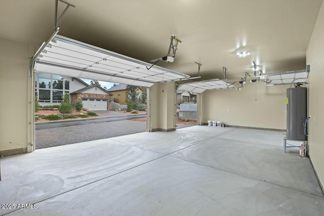 garage featuring water heater and a garage door opener