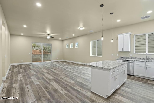 1910 E Rainbow Trl, Payson, AZ 85541 - kitchen with light wood-style flooring, a sink, visible vents, hanging light fixtures, and dishwasher