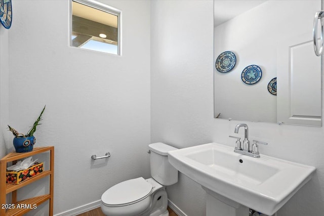 880 S 150th Dr, Goodyear, AZ 85338 - half bathroom featuring toilet and wood finished floors