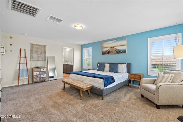 880 S 150th Dr, Goodyear, AZ 85338 - carpeted bedroom featuring baseboards and connected bathroom