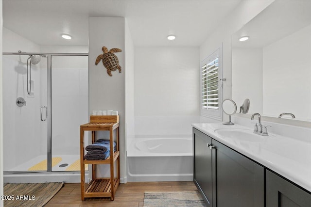 880 S 150th Dr, Goodyear, AZ 85338 - full bath featuring wood finished floors, a shower stall, a bath, vanity, and recessed lighting