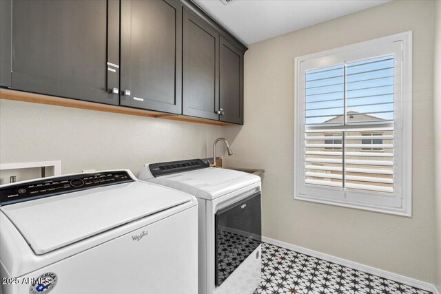 880 S 150th Dr, Goodyear, AZ 85338 - laundry room featuring light flooring, cabinet space, and separate washer and dryer
