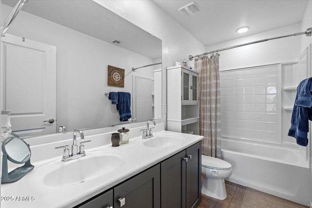 880 S 150th Dr, Goodyear, AZ 85338 - bathroom with shower / tub combo with curtain, double vanity, and wood finished floors
