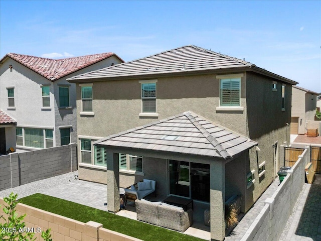 880 S 150th Dr, Goodyear, AZ 85338 - rear view of house featuring a fenced backyard, a patio area, stucco siding, and a gazebo