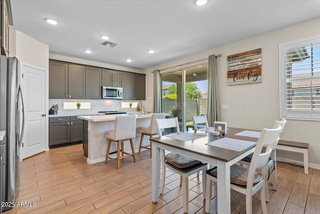 880 S 150th Dr, Goodyear, AZ 85338 - dining area featuring light wood-type flooring and recessed lighting