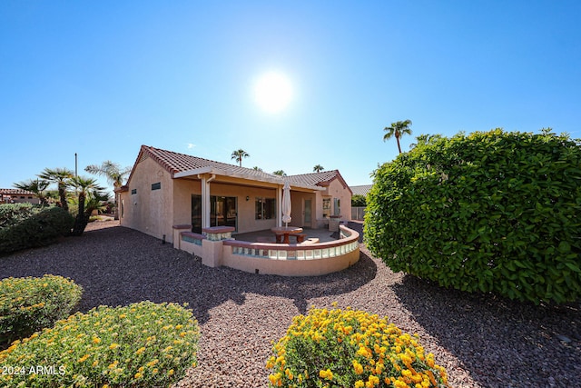 back of house featuring a patio