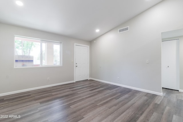 spare room featuring visible vents, recessed lighting, baseboards, and wood finished floors