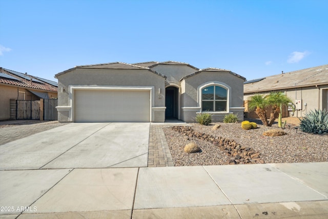 13529 W Remuda Dr, Peoria, AZ 85383 - mediterranean / spanish home with a garage, concrete driveway, stucco siding, a tile roof, and a gate