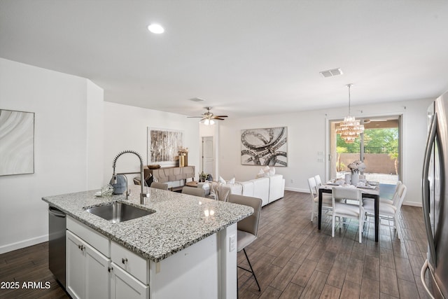 13529 W Remuda Dr, Peoria, AZ 85383 - kitchen featuring stainless steel appliances, a chandelier, a center island with sink, dark wood-style flooring, and pendant lighting