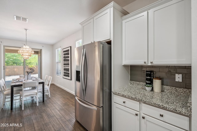 13529 W Remuda Dr, Peoria, AZ 85383 - kitchen featuring stainless steel fridge, a chandelier, decorative backsplash, dark wood-style floors, and white cabinetry