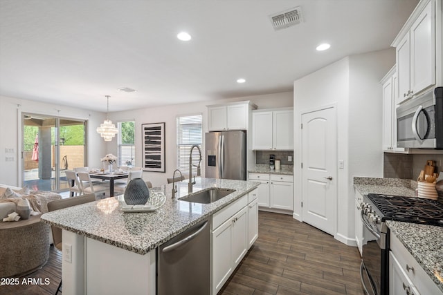 13529 W Remuda Dr, Peoria, AZ 85383 - kitchen featuring appliances with stainless steel finishes, backsplash, white cabinets, dark wood-type flooring, and recessed lighting