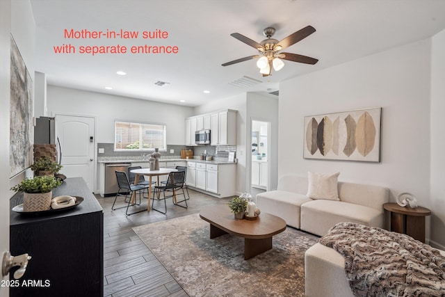 13529 W Remuda Dr, Peoria, AZ 85383 - living room featuring a ceiling fan, recessed lighting, and light wood finished floors
