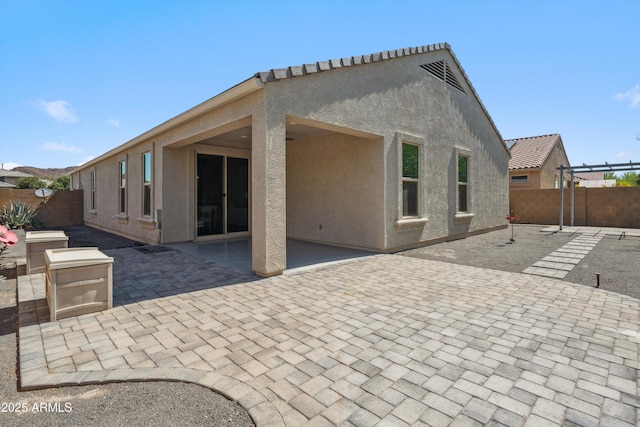 13529 W Remuda Dr, Peoria, AZ 85383 - back of house with a fenced backyard, a patio, and stucco siding