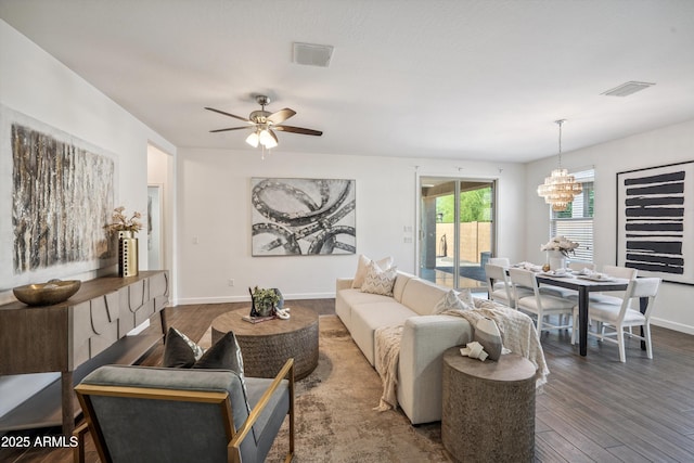 13529 W Remuda Dr, Peoria, AZ 85383 - living area featuring wood finished floors, a chandelier, and a ceiling fan