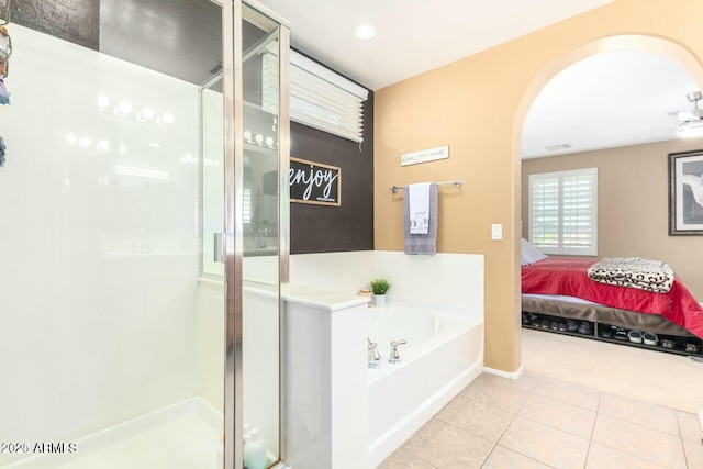 bathroom with tile patterned floors, separate shower and tub, and ceiling fan