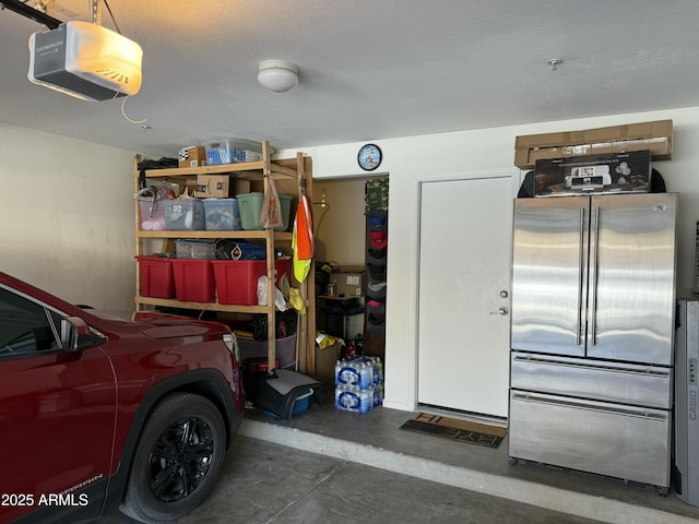 garage with high quality fridge and a garage door opener