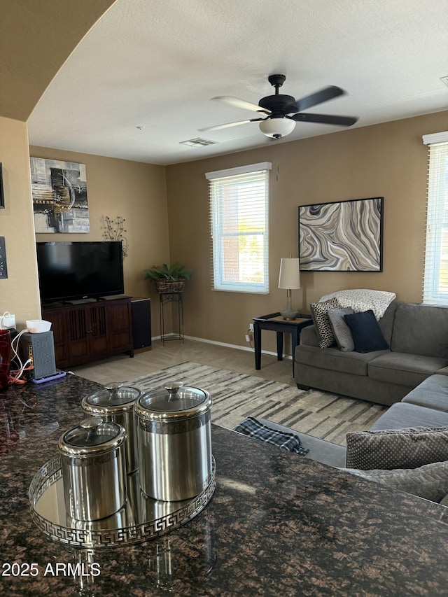 living room featuring ceiling fan