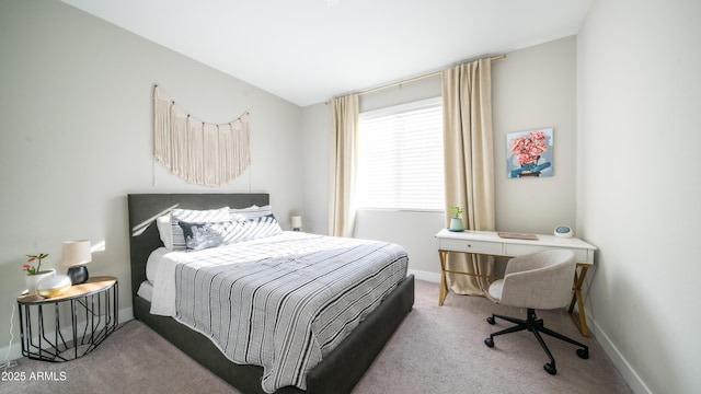 carpeted bedroom with baseboards