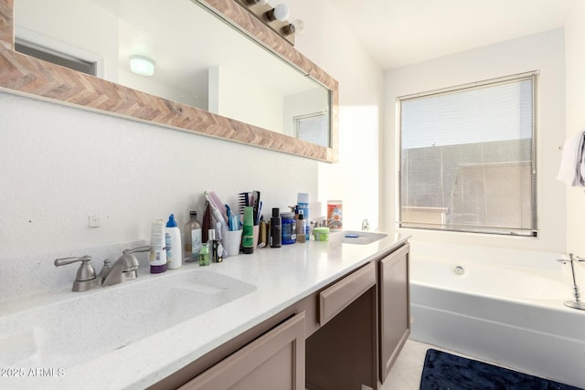 bathroom featuring vanity and a bathtub