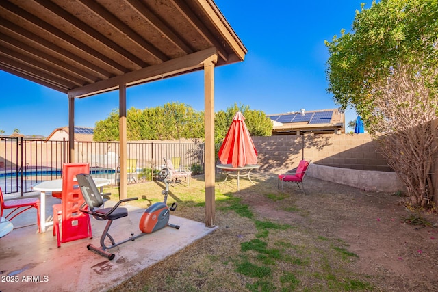 view of yard featuring a fenced in pool and a patio