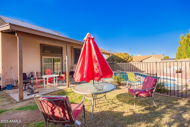 view of patio / terrace featuring a fenced in pool