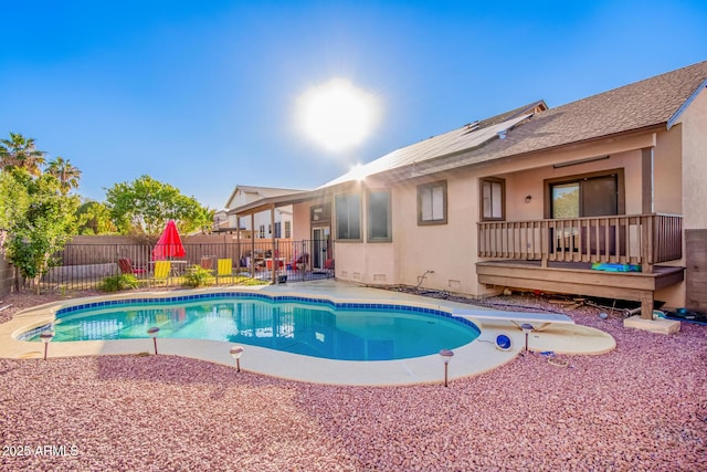 view of pool featuring a diving board and a deck