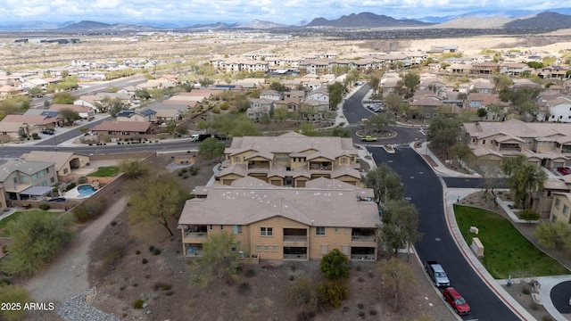 birds eye view of property featuring a mountain view and a residential view