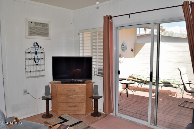 tiled living room with a wall mounted AC and wooden walls