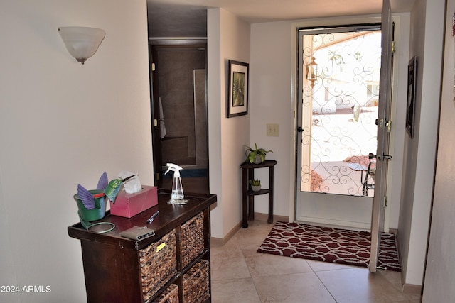 entrance foyer featuring light tile patterned flooring