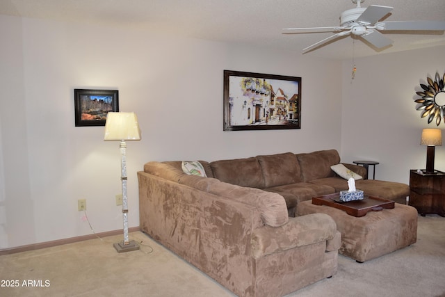 carpeted living room featuring ceiling fan