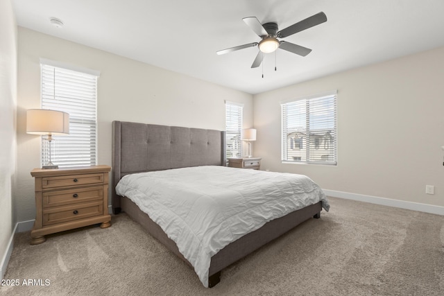 bedroom with baseboards, light carpet, and ceiling fan