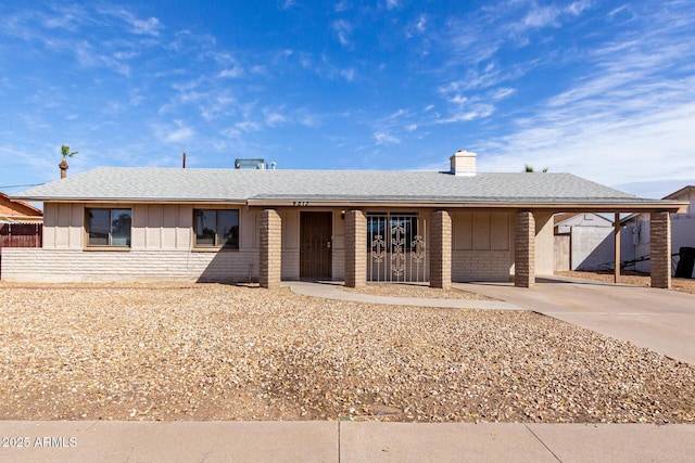 single story home featuring a carport