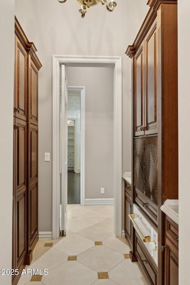 corridor featuring light tile patterned flooring