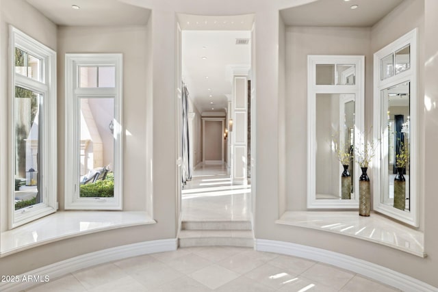 bathroom featuring tile patterned floors and a healthy amount of sunlight