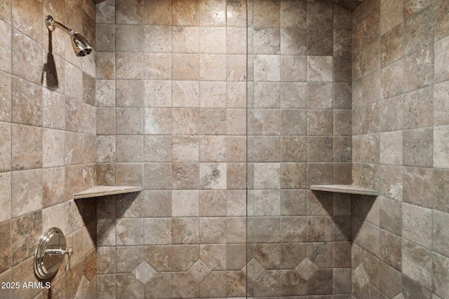 bathroom with tiled shower