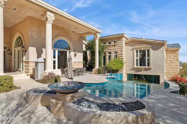 view of swimming pool with a patio